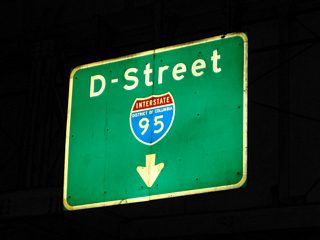An original guide sign over L'Enfant Promenade north still eludes to Interstate 95 District of Columbia via D Street east. Interstate 95 was signed along what is now Interstate 395 until 1977.