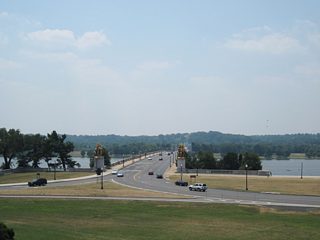 Loop ramps join the east end of the Arlington Memorial Bridge with Lincoln Memorial Circle and Ohio Drive below. The stone arch bridge was constructed in 1932 and previously carried U.S. 50 and U.S. 240. The Arts of War sculptures adorn the bridge ends.