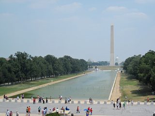 Facing east from the Lincoln Memorial Circle SW, in view is the Constitution Gardens, the Reflecting Pool, Washington Monument, and the U.S. Capitol dome.