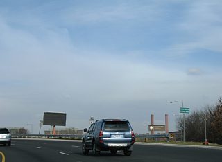 Frederick Douglass Memorial Bridge passes over Anacostia Drive and Anacostia Park on its turn across the Anacostia River.