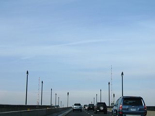 Frederick Douglass Memorial Bridge passes over Anacostia Drive and Anacostia Park on its turn across the Anacostia River.