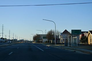 Dover is 41 miles to the north of where SR 1A (Rehoboth Avenue Extension) returns to SR 1 west from Rehoboth Beach. The 86 miles to Wilmington listed on this distance sign predates the completion of SR 1 north to I-95, instead referencing  SR 1, U.S. 113 and U.S. 13. Wilmington is instead 91 miles away via SR 1 north and Interstate 95.