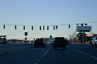 Wescoats Road (Rd 12) angles 0.46 miles north from U.S. 9/SR 1 to U.S. 9 Business (Savannah Road).