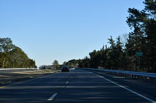 SR 1 proceeds southeast from SR 16 on Broadkill Neck to cross the Broadkill River.