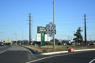U.S. 9 east combines with SR 1 south at Five Points as SR 404 ends. U.S. 9 Business ties in from Savannah Road and Lewes to the north. SR 1D/23 separate at a roundabout south of U.S. 9/SR 404. SR 23 south leads to Long Neck and SR 1D east to Midway.