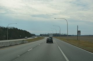 SR 1 (Bay Road) continues across farm land west of Trunk Ditch to Little Heaven. Commercial development is minimal between Dover and Milford.This reassurance marker was removed after 2022.
