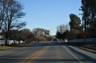 SR 1D (Plantation Road) shifts eastward between The Plantations and The Plantations East subdivisions.