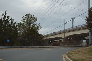Roosevelt Street curves below SR 1 to run alongside Lewes and Rehoboth Canal. The bridges above date back to 1978 for southbound and 1985 for northbound.