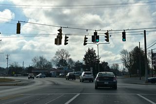 SR 1 Business curves southeast from Walnut Street onto Rehoboth Beach at NE 10th Street. Walnut Street continues south to Downtown Milford.