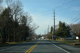 Acorn Lane links White Oak Road with SR 8 (Little Creek Road) by this reassurance marker. The state route shifts onto Division Street just ahead.
