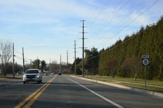 West from the SR 1 overpasses, SR 8 slows through residential areas by the Lexington Green and Acorn Farms subdivisions.