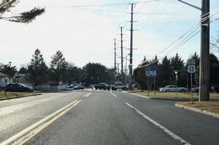Division Street arcs southward between the older Dover Heights and Edgehill Acres communities to U.S. 13 (Dupont Highway).