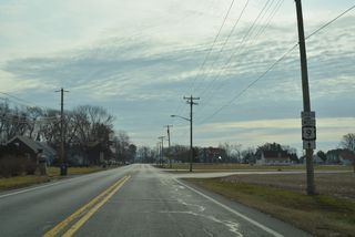 A trailblazer directed U.S. 9 Truck south from Arrow Safety Road. As of 2024, Arrow Safety Road leads the realigned truck route west directly to U.S. 113 (Dupont Boulevard).
