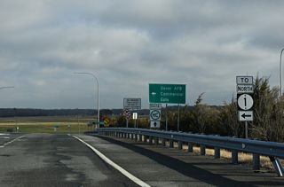 The exchange joining SR 1/9 is part of a truck route for the Dover AFB Commercial Gate for motorists along SR 1 south. Truck traffic is directed back north from the SR 9 entrance ramp to Exit 92 nearby.