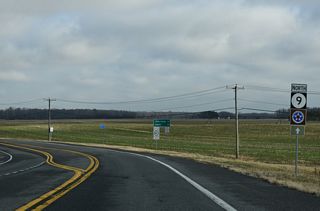 SR 9 runs along the boundary of Dover AFB nort toward Postles Corner. Agricultural land spreads along the east side of Bayside Drive on this stretch.