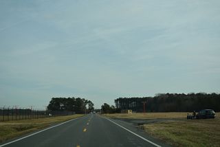 The original alignment of Park Avenue circumvented Delaware Coastal Airport (GEN) along a 3.5 mile long course from Bedford Street to U.S. 9 (Lewes Georgetown Highway). U.S. 9 Truck passed just south of the main runway along what is now Old Park Avenue in this scene.