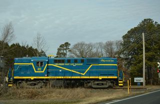 U.S. 9 Truck crosses the Delaware Coast Line Railroad at Saulsbury Switch. The DCLR runs east from Georgetown to Lewes.