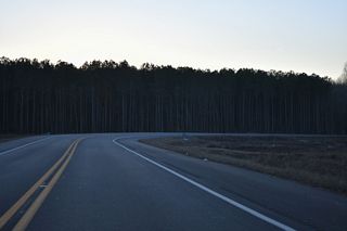U.S. 9 Truck (Park Avenue) continues through an S-curve from Old Park Avenue to an at-grade crossing with the Delmarva Central Railroad.