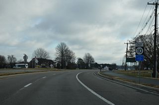 SR 10 (Lebanon Road) continues east by the Tidbury Manor subdivision to the north of Tidbury Creek.