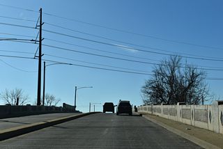 U.S. 13/SR 9 (Heald Street) proceed south across the Paul Livingston Bridge spanning a Norfolk Southern Railroad line and the ramp leading SR 9 south to New Castle Avenue.