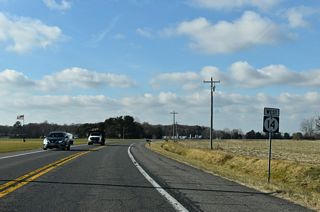 Greenville Road (Rd 305) heads 0.73 miles west from Andrewville Road and the settlement of Greenville to SR 14 (Vernon Road) ahead of this westbound shield assembly.