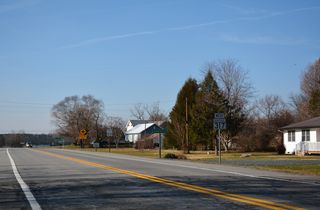 SR 14 (Vernon Road) transitions to MD 317 (Burrsville Road) across the state line at Burrsville.