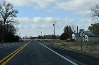 Parker Road (Rd 301) arcs 2.41 miles southwest from SR 14 to Taber State Forest and the Maryland state line ahead of this shield.