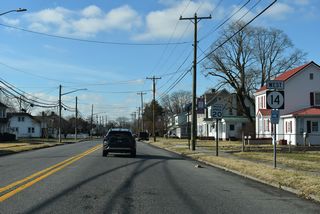 SR 14 continues west from U.S. 13 (Dupont Highway) along Clark Street into the Harrington residential street grid.
