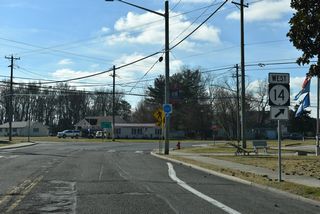 SR 14 curves west onto Walt Messick Road from Commerce Street at West Street and Farmington Road in Harrington.
