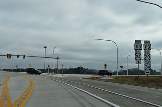 SR 20 east joins U.S. 113 south for 3.2 miles through Millsboro. As of September 26, 2025, SR 24 overlaps with the two routes from the North Millsboro Bypass to Laurel Road. Betts Pond Road ties into the north end of the overlap from Betts Pond and State Street near Downtown Millsboro.