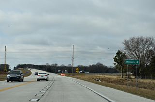 SR 30 (Gravel Hill Road) runs 0.7 miles south to John J. Williams Highway just ahead of the bridge taking SR 24 Business across the Indian River into the town of Millsboro.