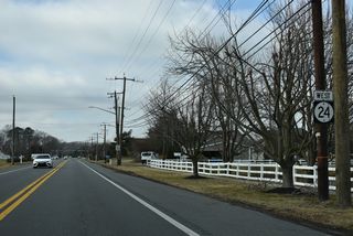 SR 24 (Millsboro Highway) follows the Millsboro town line west between the Retreat at Millstone and Plantation Lakes developments.