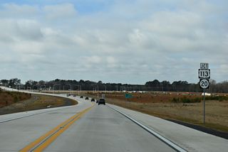 The North Millsboro Bypass spans Fox Run Road (Rd 326) west ahead of a parclo B2 interchange (Exit 12) with U.S. 113/SR 20 (Dupont Boulevard).