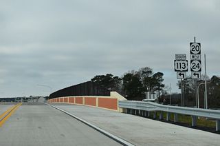 The North Millsboro Bypass transitions onto SR 20 (Hardscrabble Road) west from the exchange with U.S. 113 (Dupont Boulevard). SR 20 east combines with U.S. 113 south and SR 24 west at the forthcoming entrance ramp.