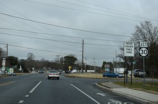 Beyond the Indian River and Millsboro, SR 30 branches north from SR 24 Business (John J. Williams Highway) to Zoar and Milford. Traffic lights were temporarily installed here in 2024.