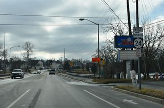 Crossing Millsboro Pond south of SR 30, SR 24 Business enters the town of Millsboro.