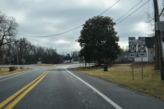 SR 30 (Gravel Hill Road) ends at SR 24 Business (John J. Williams Highway) just north of the Millsboro town line. SR 24 Business was established in Fall 2025 along the former route of SR 24 through Downtown Millsboro.