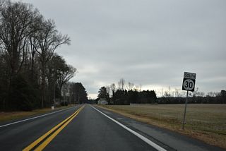 SR 30 (Gravel Hill Road) continues south from Shingle Point Road by remaining farm land to Prettyman Road (Rd 254).