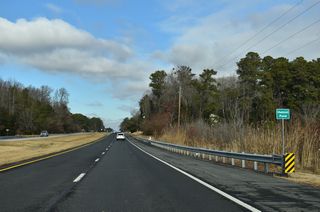 U.S. 113 north passes Hudson Pond across Cedar Creek.