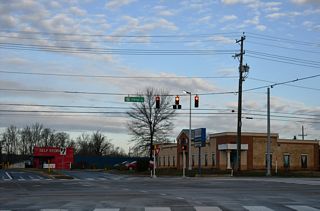 Otts Chapel Road ties into SR 279 (Elkton Road) across from a self storage business, adjacent to a large industrial park.