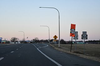 SR 404 (Seashore Highway) curves west to intersect U.S. 13 across from SR 404 Business (S Main Street).