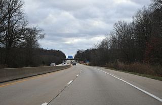The ensuing 1.9 miles of SR 71/896 south across the Summit Bridge constitute a limited access expressway.
