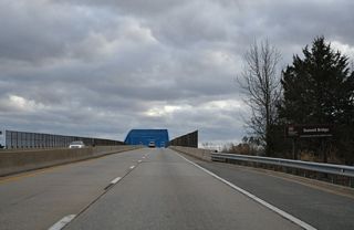 Maintained by the U.S. Army Corps of Engineers, the Summit Bridge opened to traffic on January 9, 1960. The prior crossing of SR 71/896 was to the east.
