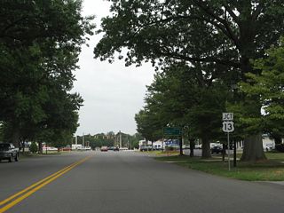 Junction U.S. 13 shield posted on Loockerman Street east ahead of Dupont Highway. Loockerman Street becomes a residential street beyond Dupont Highway en route to SR 8 (East Division Street).