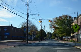 Pedestrian flashers on Academy Street south at the UD Perkins Student Center.  