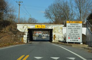 The vertical clearance for the CSX Railroad Bridge over Casho Mill Road was lowered from 8'9" and 8'7".