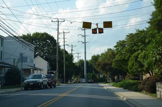 A set of warning beacons for the approaching CSX Railroad bridge.