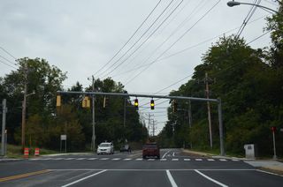 A mast arm signal assembly was added at Old Paper Mill Road in 2001 to serve adjacent subdivisions.
