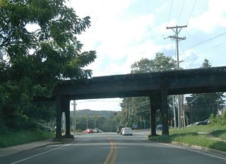 Located next to the north entrance to Newark Shopping Center, the CSX Railroad bridge over Chapel Street dates to 1920. Until 1980, a second railroad line to Avondale, PA ran diagonally across Chapel Street and adjacent Cleveland Avenue here at-grade.
