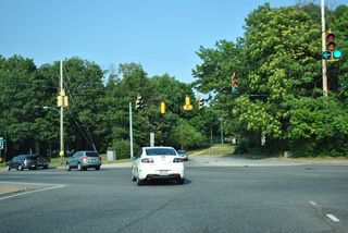 Cleveland Avenue concludes at SR 2/72 (Capitol Trail) opposite Woodlawn Avenue, a local residential street.